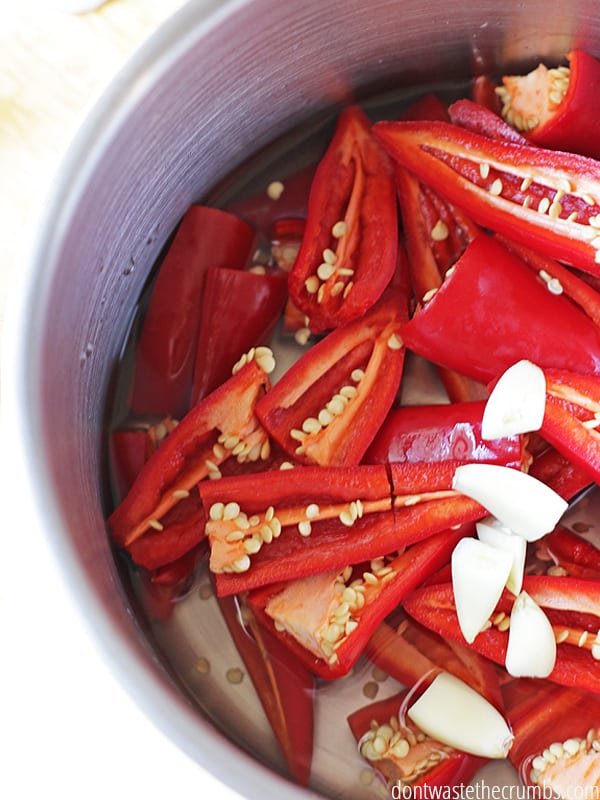 All of the flavors begin to come together when you add the peppers with the vinegar and garlic to a saucepan and boil! ::dontwastethecrumbs.com