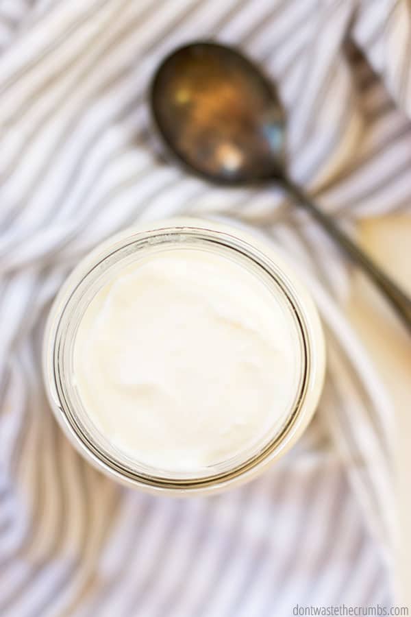 Homemade yogurt in a glass mason jar.