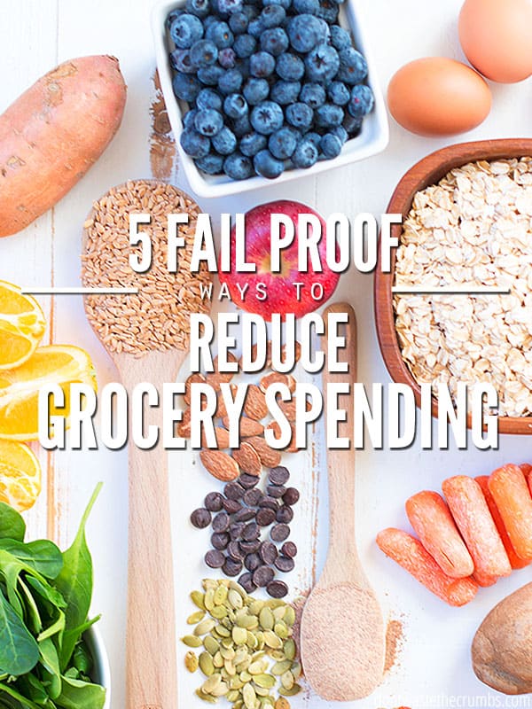 These 5 fail-proof ways to saving on food. 
Sweet potato, bowl of blueberries, two eggs, two slices of oranges, a bowl of spinach, a wood spoon full of grains, almonds, chocolate chips, seeds, apple, a wood spoon, carrots, and a bowl of oats beautifully arranged on a table. Text overlay reads "5 Fail Proof Ways to Reduce Grocery Spending"