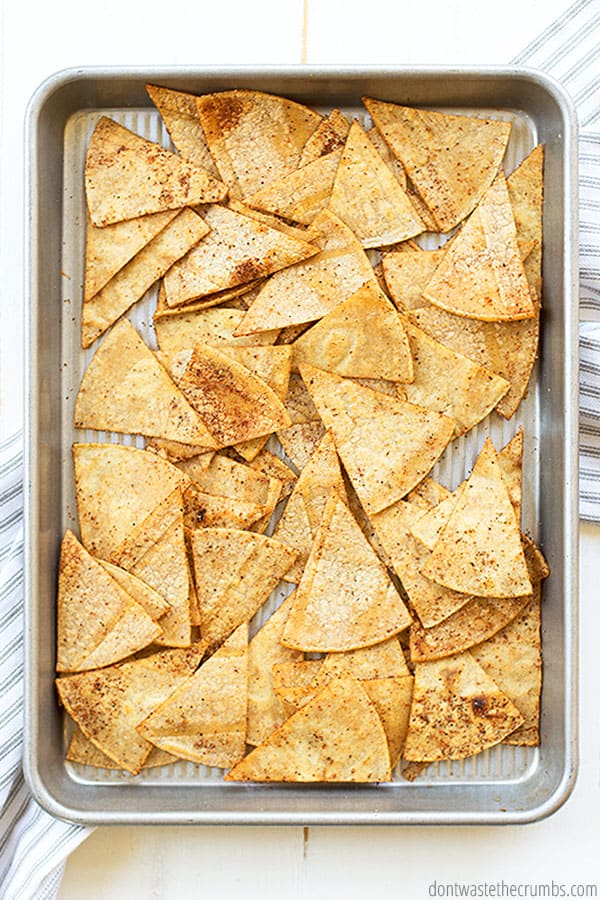 A sheet pan with homemade tortilla chips.
