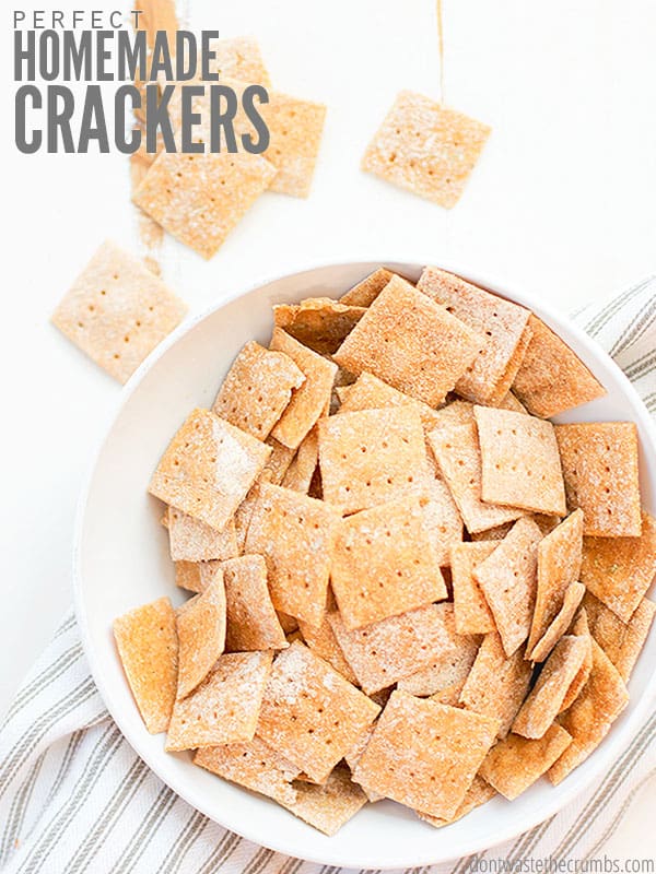 Delicious homemade cracker recipe! Image showing a bowl of crackers with some scattered throughout the image. Text overlay reads Perfect Homemade Crackers