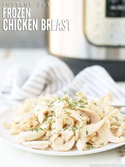 This super easy recipe for Instant Pot frozen chicken breast uses just 2 ingredients and is perfect for a quick dinner! Goes perfectly with cilantro lime rice, roasted broccoli, or Hasselback potatoes. :: DontWastetheCrumbs.com