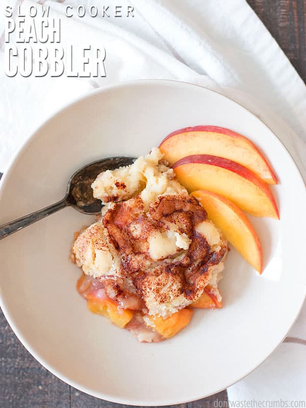 This slow cooker peach cobbler was created after the peach cobbler dump cake, except this version is so much healthier! Using fresh peaches and homemade yellow cake mix, I'm proud to take this to any pot luck! :: DontWastetheCrumbs.com