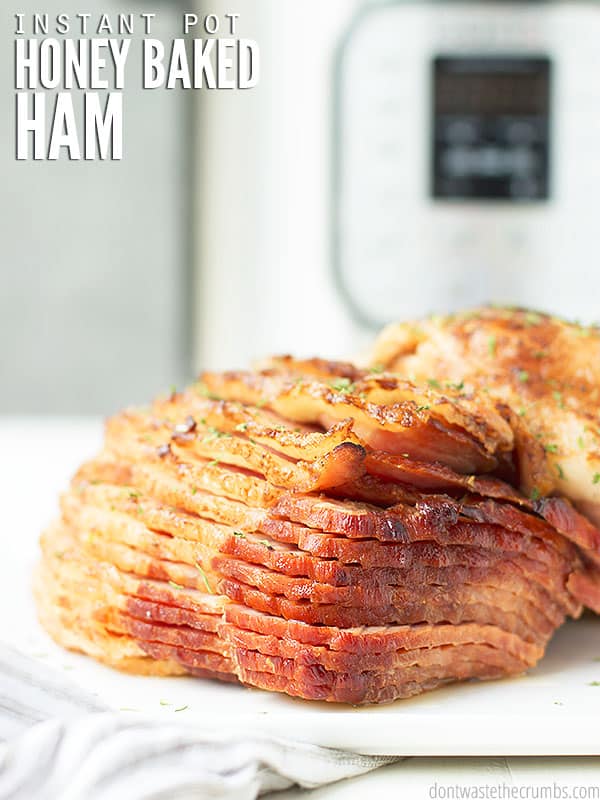 This Instant Pot Honey Baked Ham is the best way to serve an easy & flavorful spiral sliced ham at your holiday gatherings! Seasoned to perfection with fresh herbs if desired.