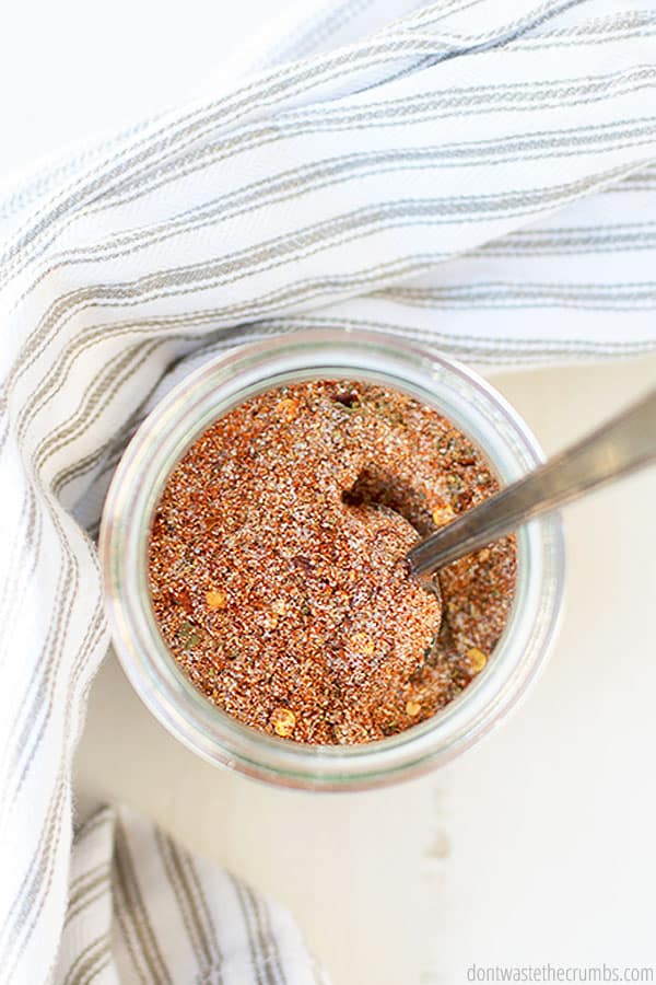 Overview of homemade seasoning Cajun with a spoon in it.