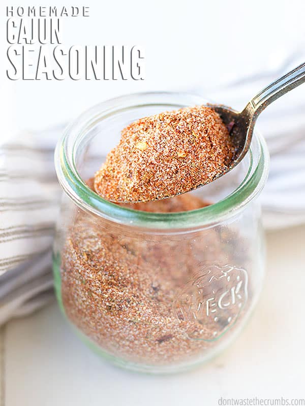 Flavorful and robust seasoning in a glass seasoning jar. The text overlay says, Homemade Cajun Seasoning"