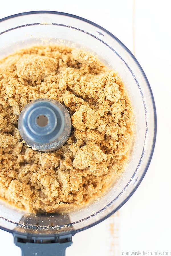 Pie crust ingredients in a food processor to be prepared and formed into a spectacular graham crust.