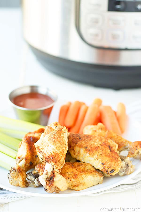 Enjoy Instant Pot Chicken Wings with my homemade buffalo sauce and a variety of vegetables sliced in strips. These wings are juicy, tender and SO flavorful! You will love making wings in the Instant Pot! 