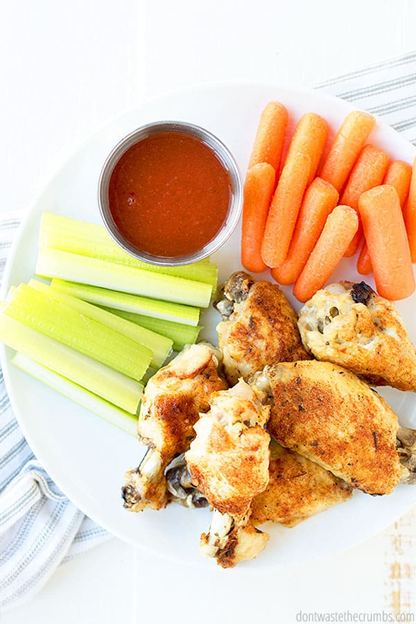These instant pot chicken wings are slathered in homemade buffalo sauce. Delicious celery and carrots sit along side with extra buffalo sauce for dipping!