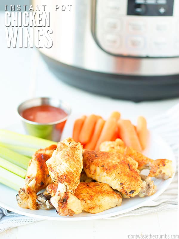 These are easy Instant Pot chicken wings. Paired on the side are carrots and celery. A side of homemade buffalo sauce will complete this dish!