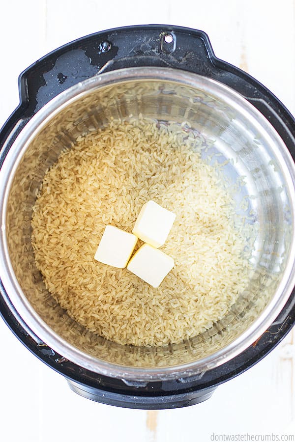 Dry rice and three cubes of butter in an instant pot