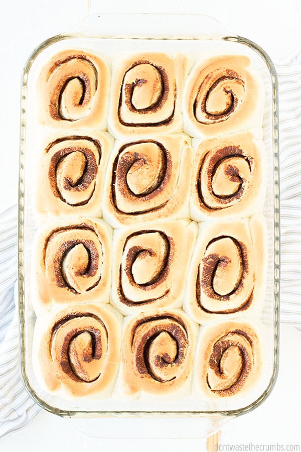 Homemade cinnamon rolls are baked and ready to be finished with homemade glaze. 