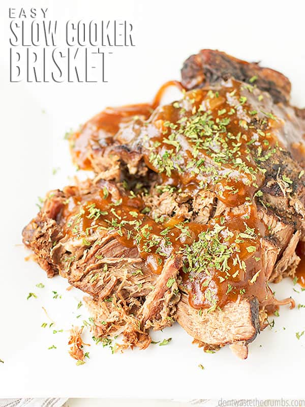 This easy Slow Cooker Brisket comes out so tender and juicy. Hands-free recipe, simmers in tangy homemade BBQ sauce and can even be doubled or tripled! Perfect for batch cooking, or serving a group!  