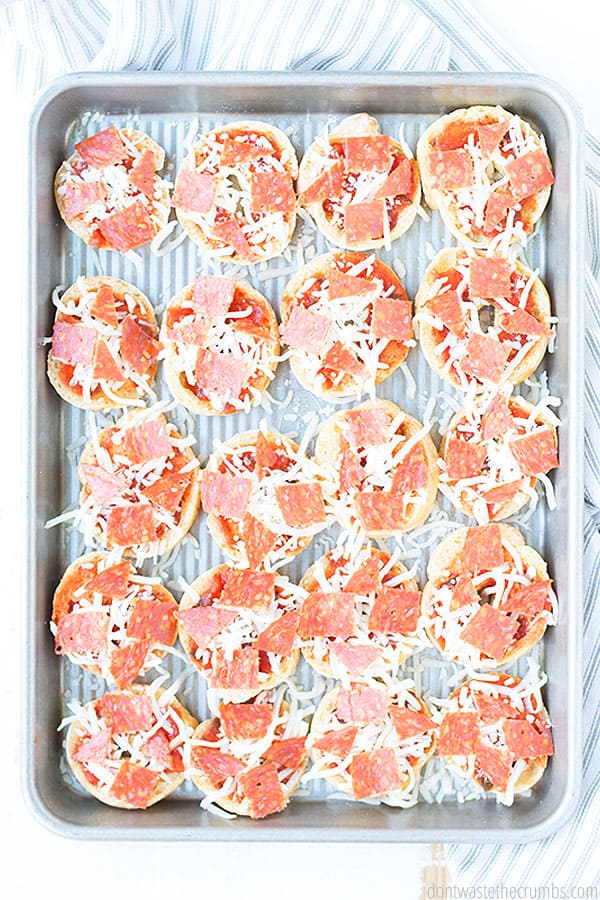 These easy and healthy pizza bagel bites are ready to be placed into the oven! Topped with cheese and sprinkled pepperoni throughout hits the spot!