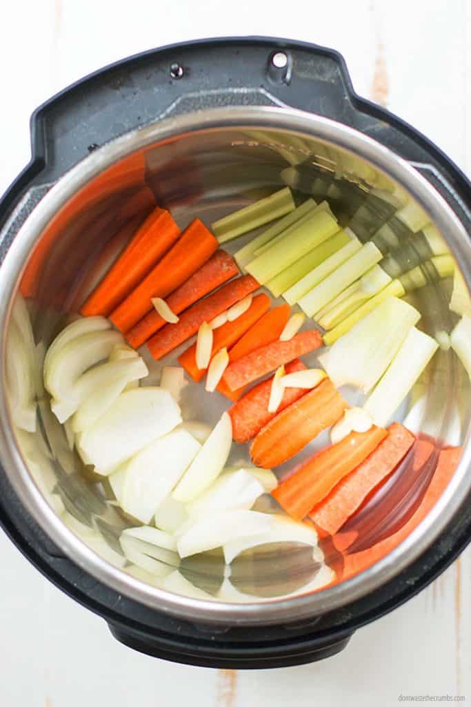 Add water and your chopped vegetables to the Instant Pot.