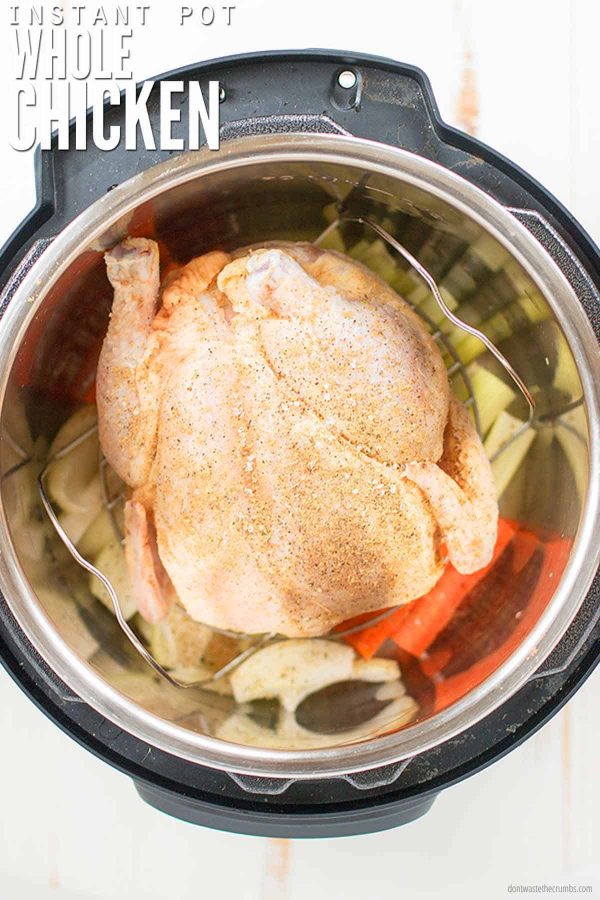 Image of whole chicken and veggies in an Instant Pot. Text overlay reads Instant Pot Whole Chicken