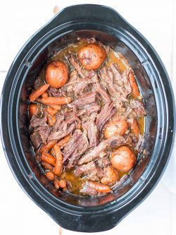 This crock pot pot roast is SUPER easy and with just 15 minutes of hands-on time, it practically cooks itself! Use 5-minute homemade cream of mushroom soup and serve with a simple salad with homemade Italian dressing and dinner is DONE!