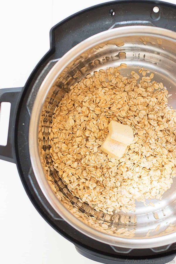 Instant Pot with rolled oats and two cubes of butter