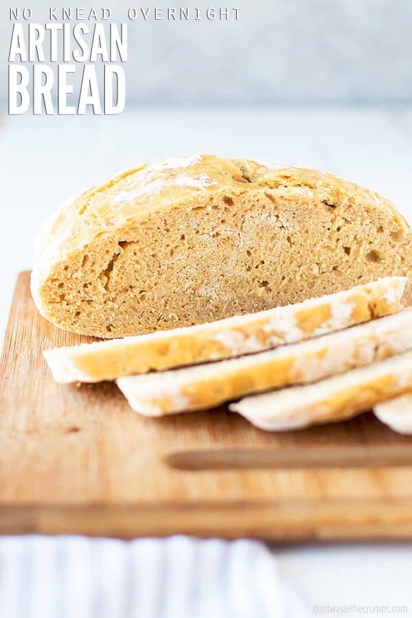Image showing half of an artisan bread loaf and slices of bread on a cutting board. Text overlay reads No Knead Overnight Artisan Bread