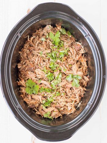 This is the best slow cooker carnitas recipe I've had, and I've eaten lots of tacos! We keep coming back to this recipe because it's so tasty and easy! Serve with delicious cilantro-lime coleslaw and easy cilantro lime rice in your meal will be a hit!
