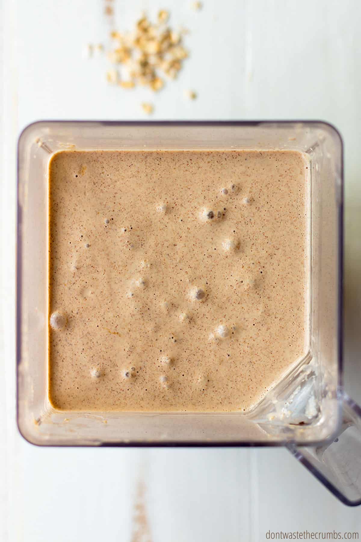 Freshly blended oatmeal batter in a blender ready to be made into oatmeal waffles.