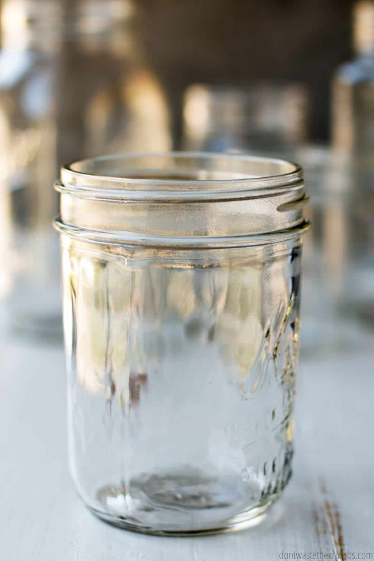 This pint size mason jar has straight edges and a wide mouth.