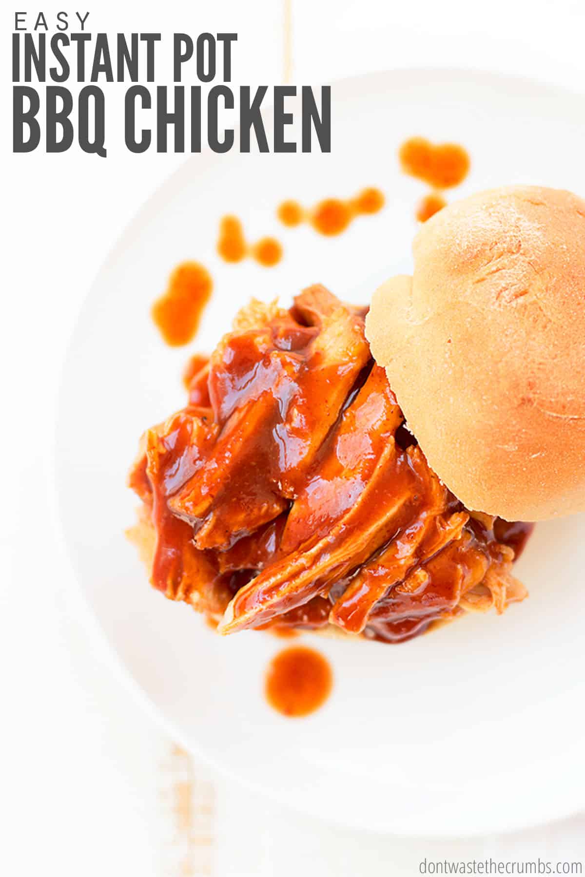 Barbecue chicken slathered in tangy barbecue sauce is topped by a homemade bun.