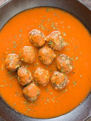 These delicious meatballs are sitting in tasty sauce within a pan. Try this simple meatball recipe with your favorite pasta dinner, or pack it for lunch. It’s freezer-friendly, versatile, and takes only 15 minutes to make!