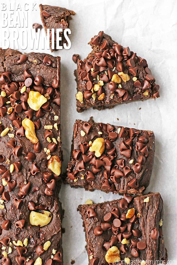 Freshly baked black bean brownies cut into squares, topped with chocolate chips and walnuts. The text overlay reads "Black Bean Brownies."
