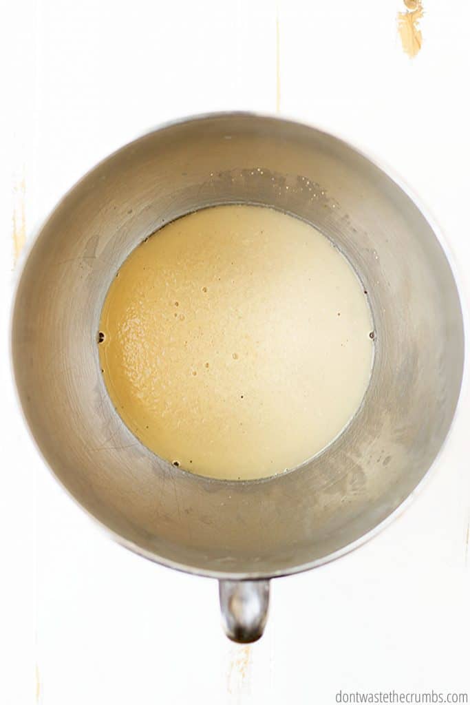 Active yeast is rising while making pizza dough recipe
