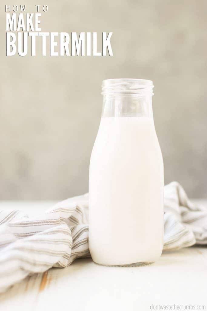 A full bottle of buttermilk sits in front of a gray pinstriped towel. The text overlay reads "How to Make Buttermilk."