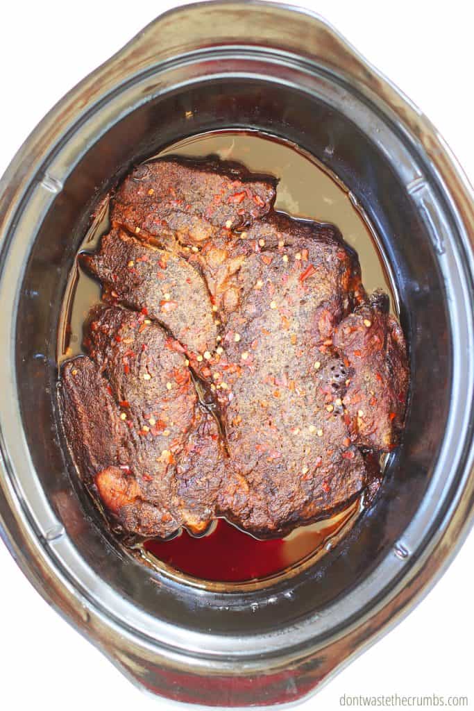 Balsamic beef pot roast is cooked to perfection after roasting for 10 hours in the slow cooker. 