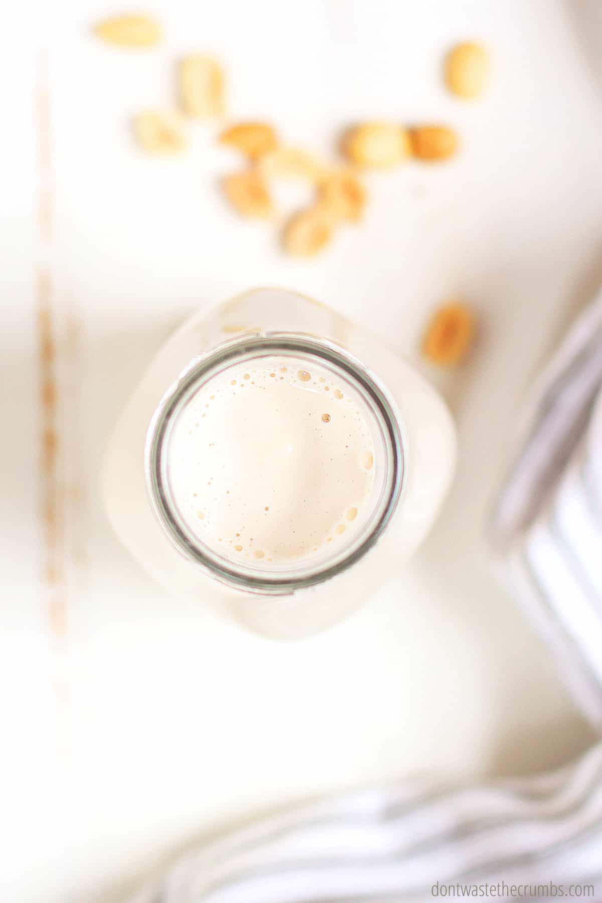 A bottle of freshly blended peanut milk. Smooth, creamy and ready to drink!