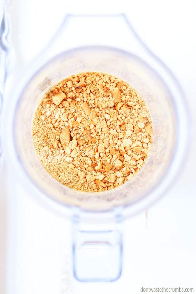 Pictured is a crushed pretzels in a blender. This is the first step in making peanut butter granola bars.