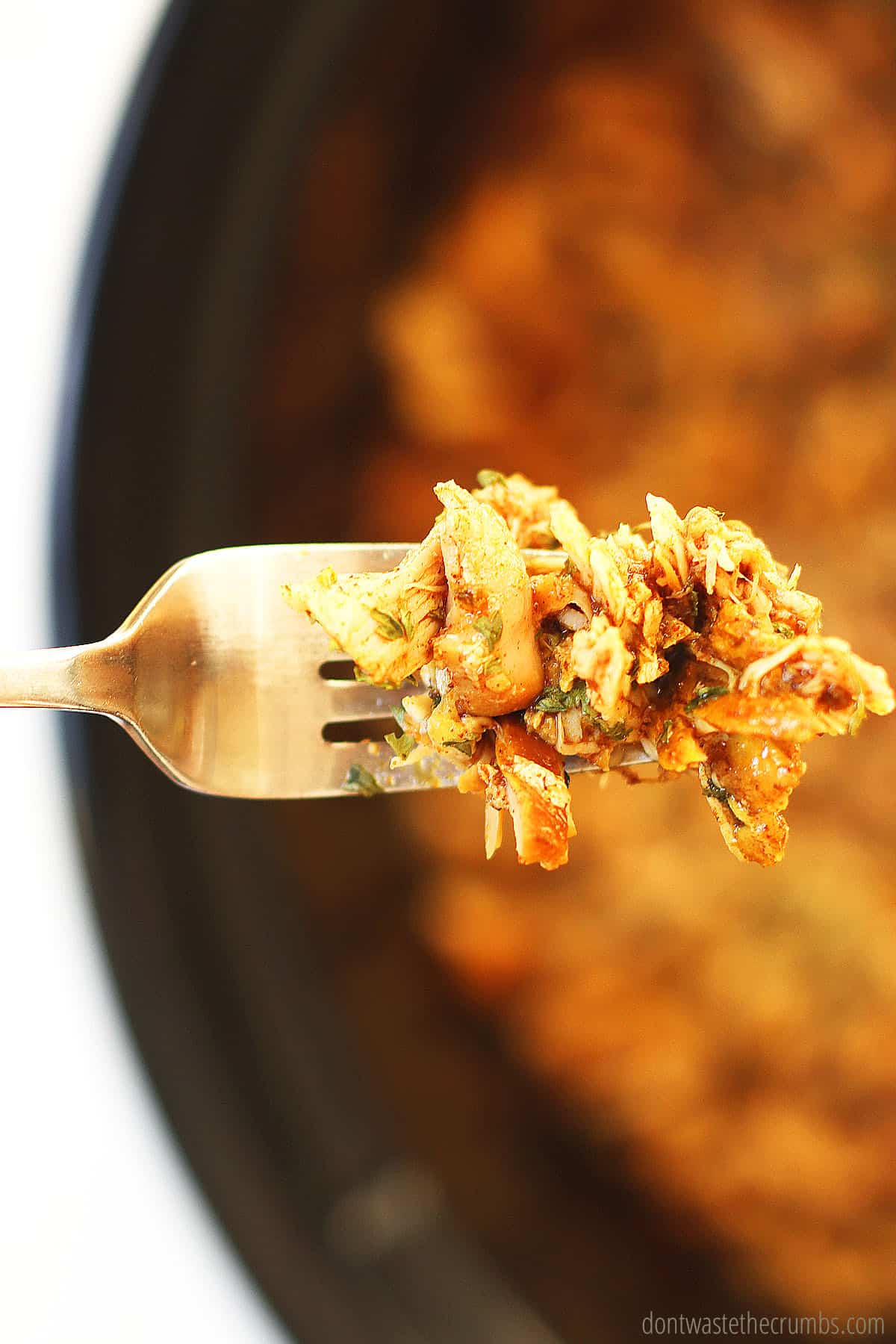 A fork full of chicken, beautifully seasoned homemade shawarma, ready to be enjoyed as-is or in a wrap!