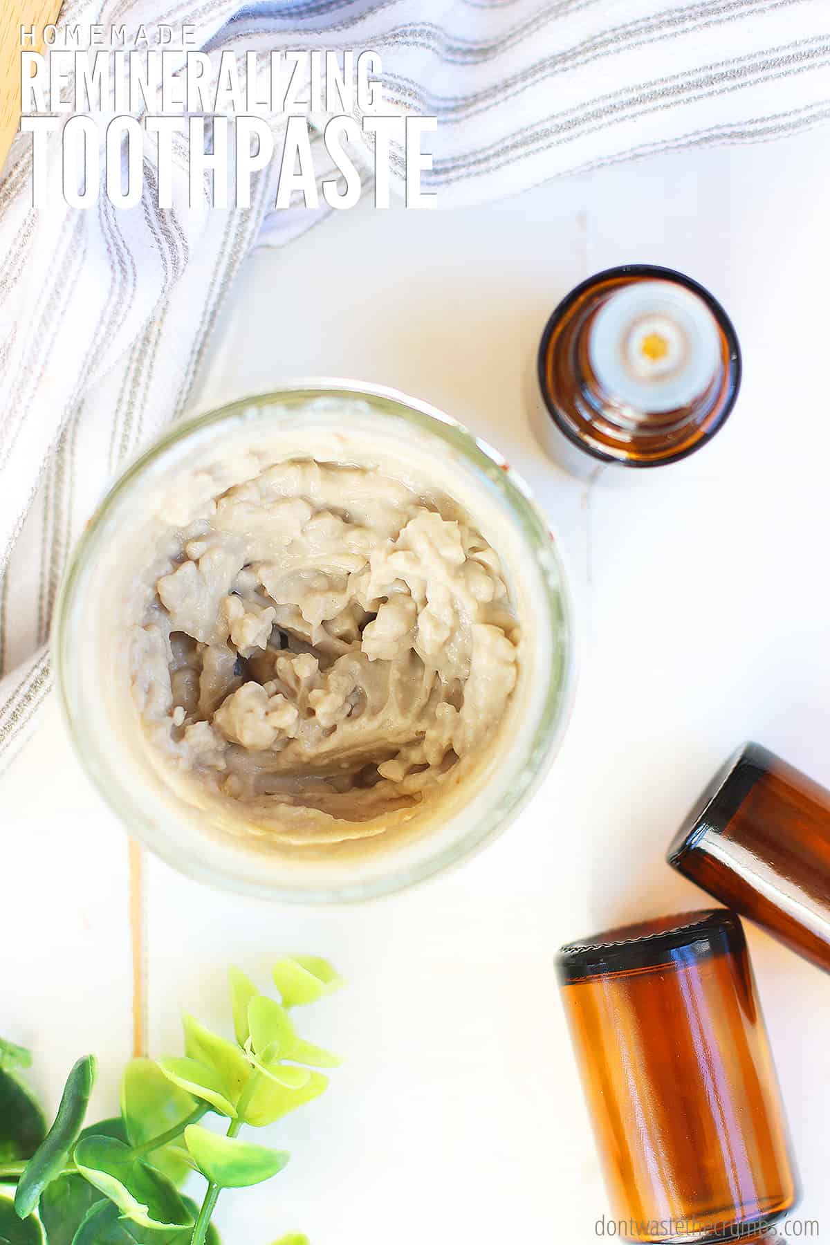 A bowl of remineralizing toothpaste recipe using bentonite clay to heal cavities. It's the best natural toothpaste we've ever tried, and our dentist agrees!