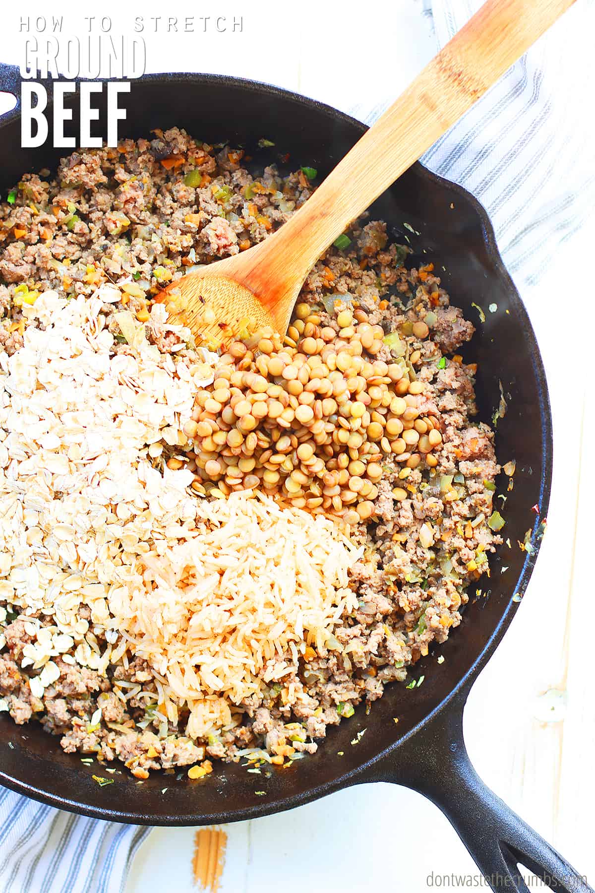 Image shows ground beef cooking in a skillet with lentils, rolled oats, and veggies with a wooden spoon stirring the ingredients. Text overlay reads How to Stretch Ground Beef