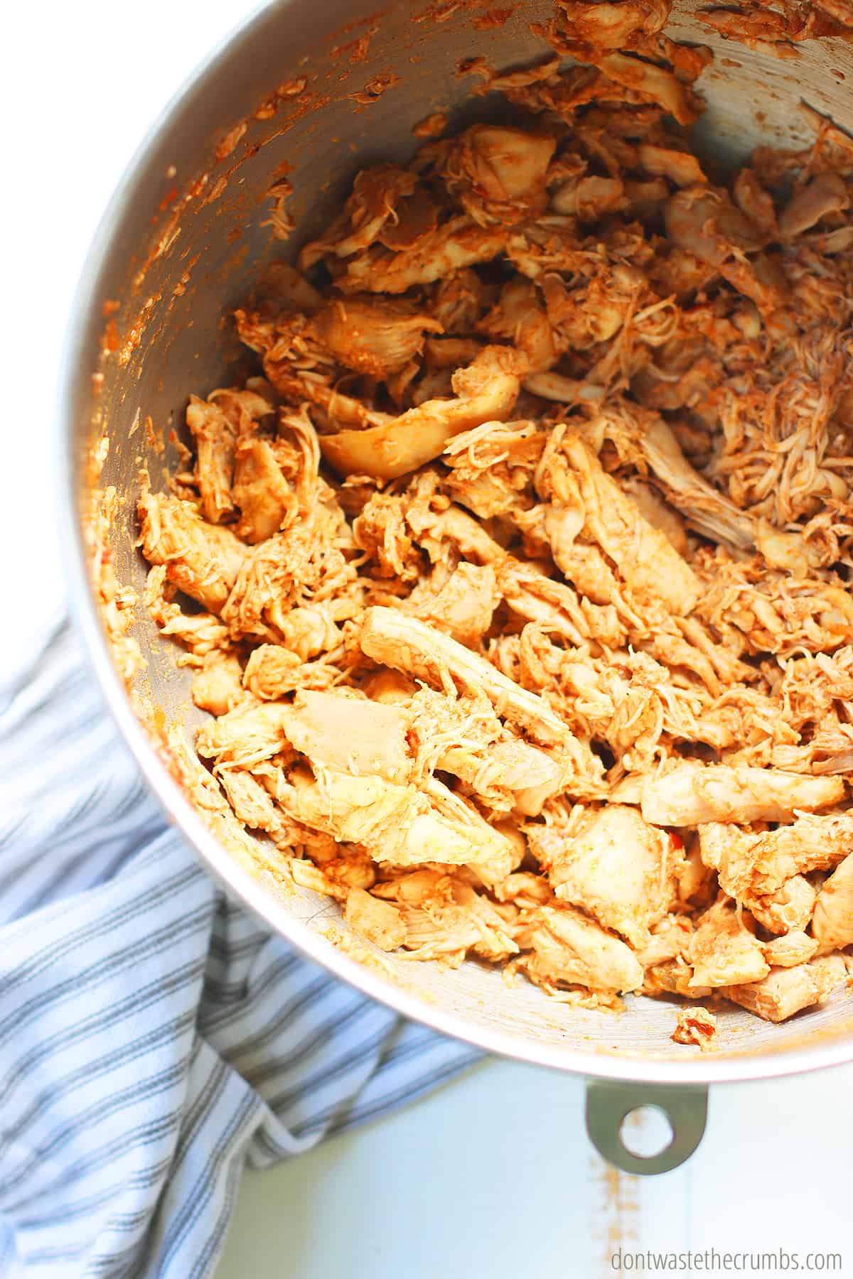 Shredded chicken in a bowl. These are for slow cooker chicken tacos.