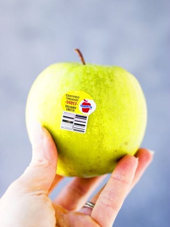 Green apple with a PLU sticker.