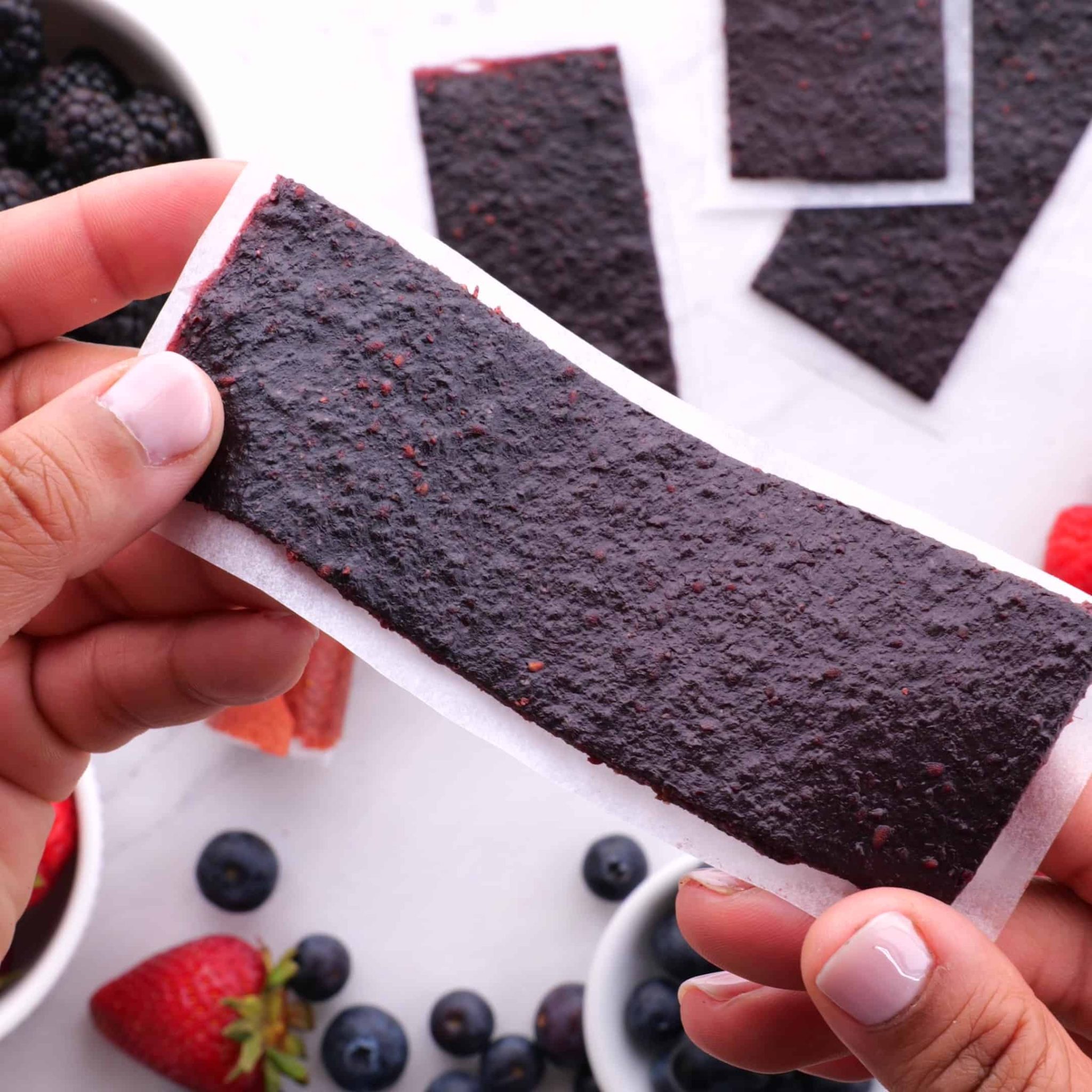 A freshly cut strip of mixed berry fruit leather - perfect for a healthy middday snack.