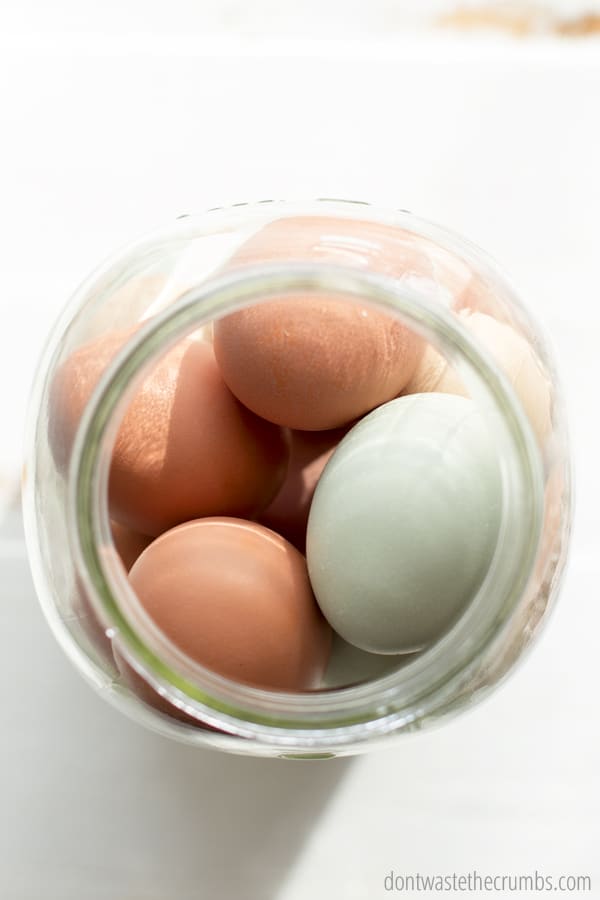 A half-gallon jar filled up with farm fresh eggs.