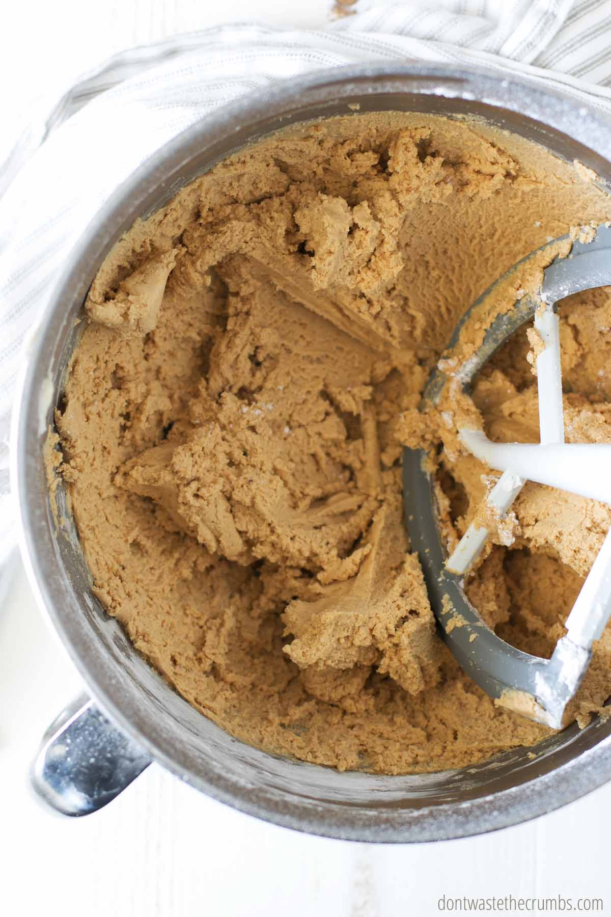 Mixing peanut butter frosting recipe in mixer.