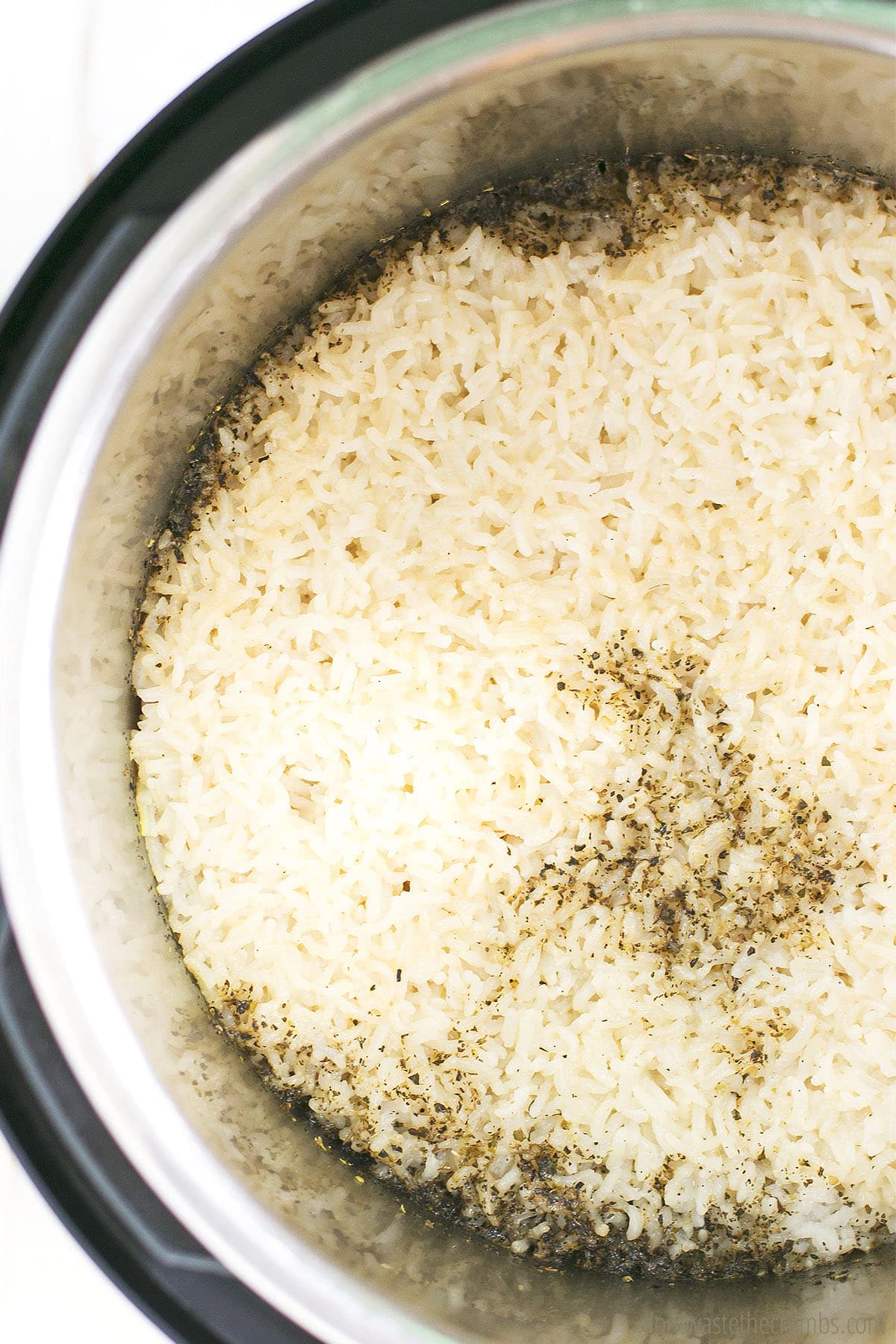 Rice and seasoning in an Instant Pot.