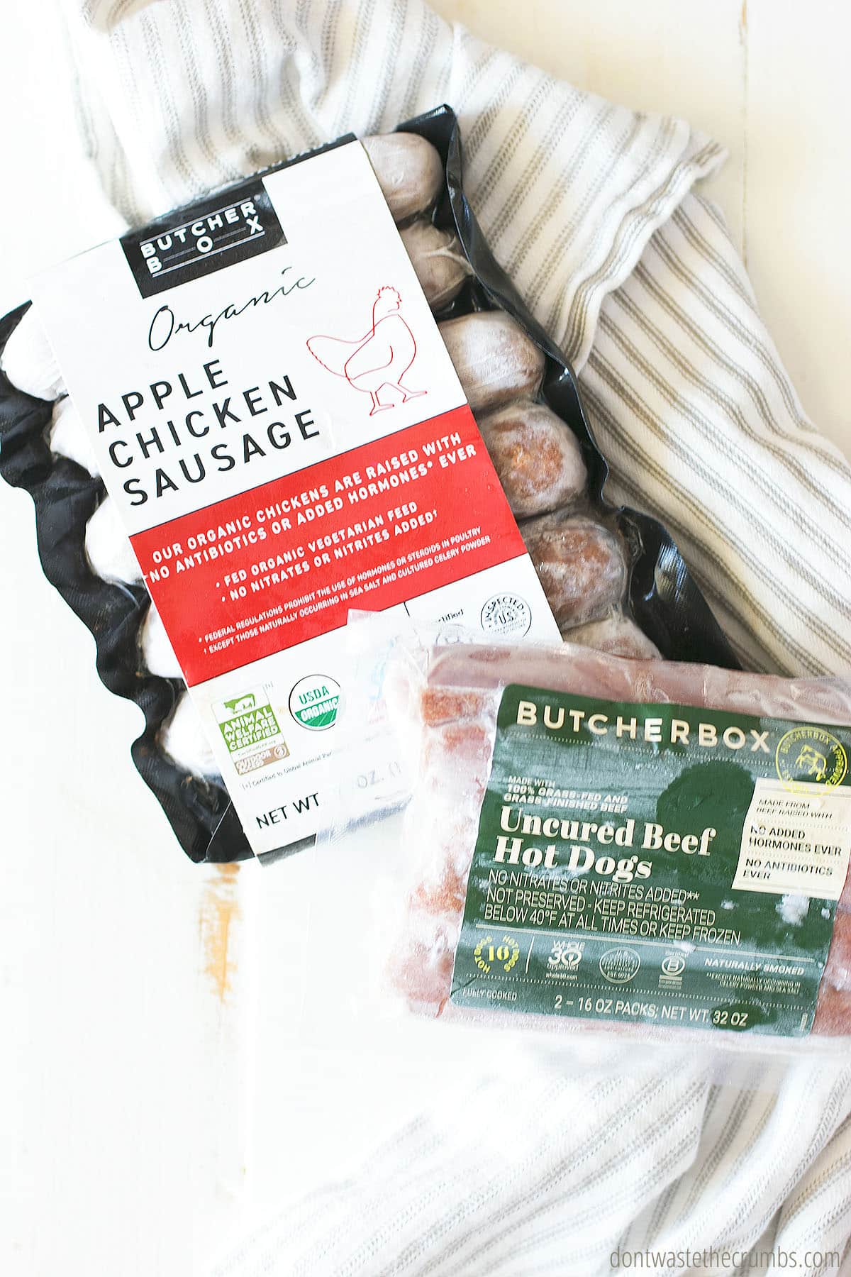 Packaged organic apple chicken sausage and uncured beef hot dogs from ButcherBox