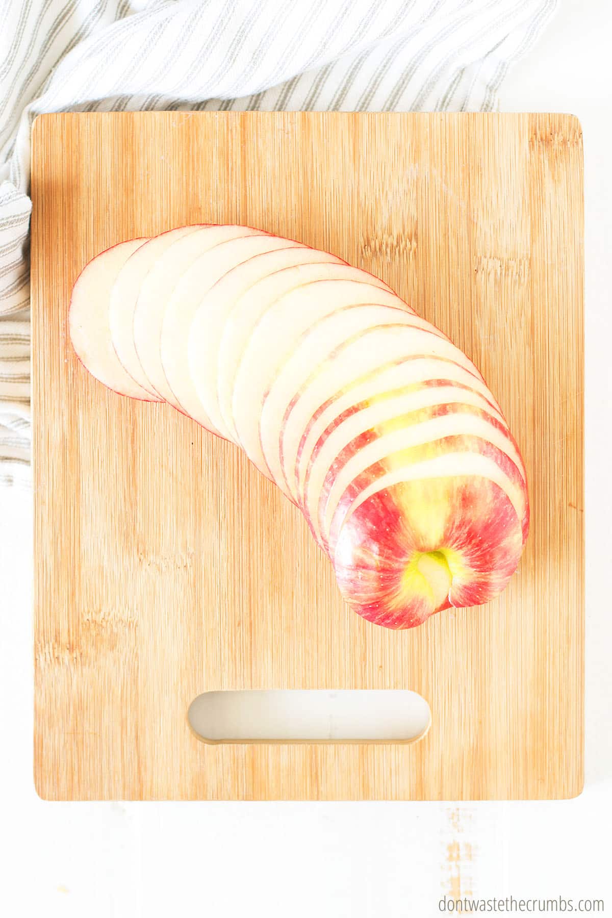 sliced apples on a cutting board