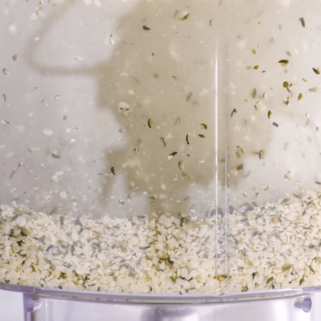 Close up view of hemp milk being blended in a blender
