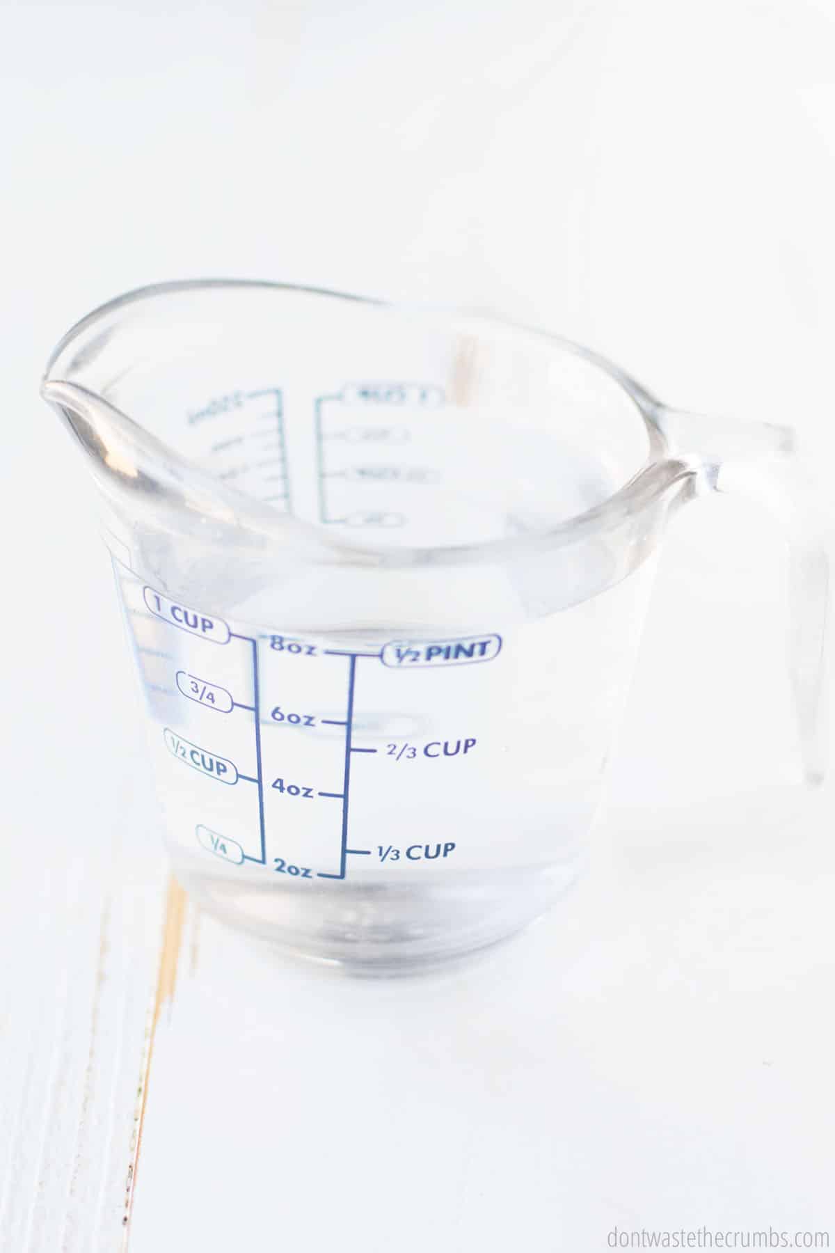 Measuring cup with water in it
