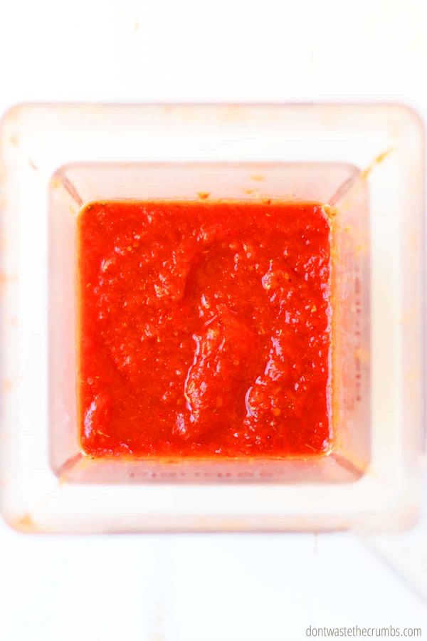 Freshly blended sauce for Instant Pot chicken tinga inside of a Blendtec blender.