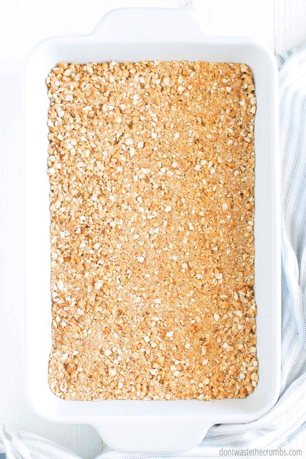 Food processed pretzel mixture pressed into the bottom of an 8 x 11 baking dish to form a bottom pretzel crust.